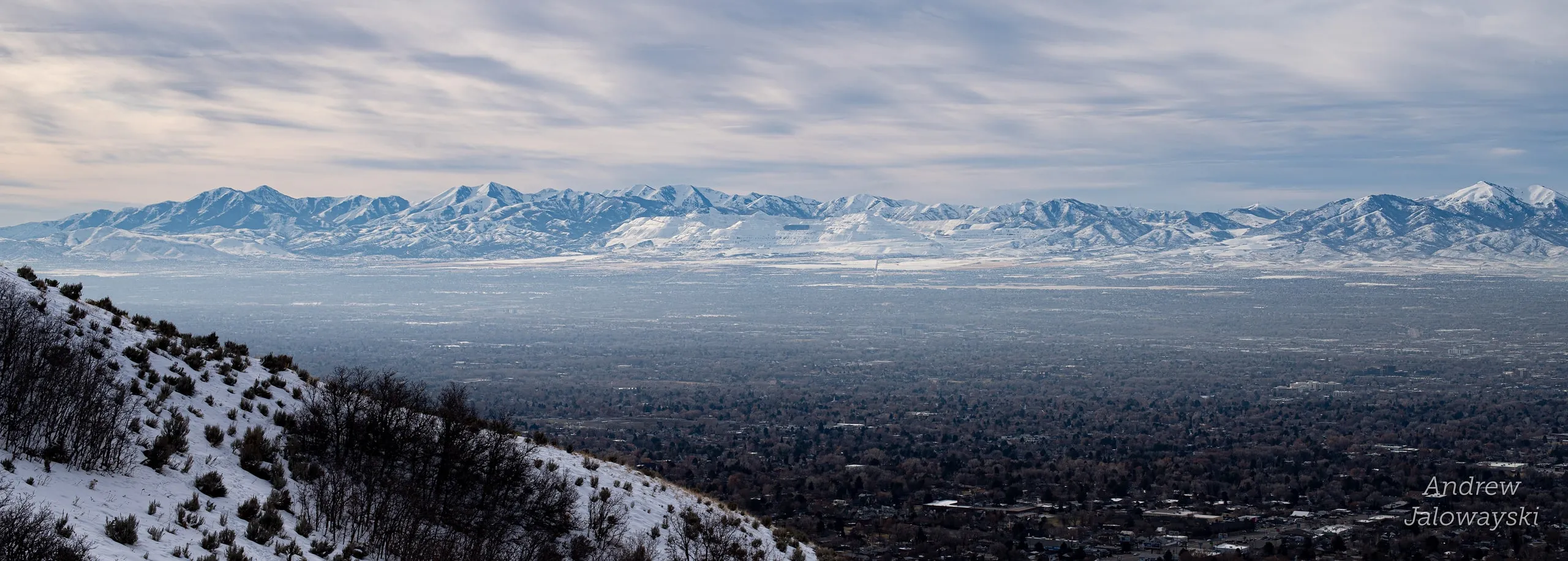 Snowy ridge above a hazy Salt Lake valley