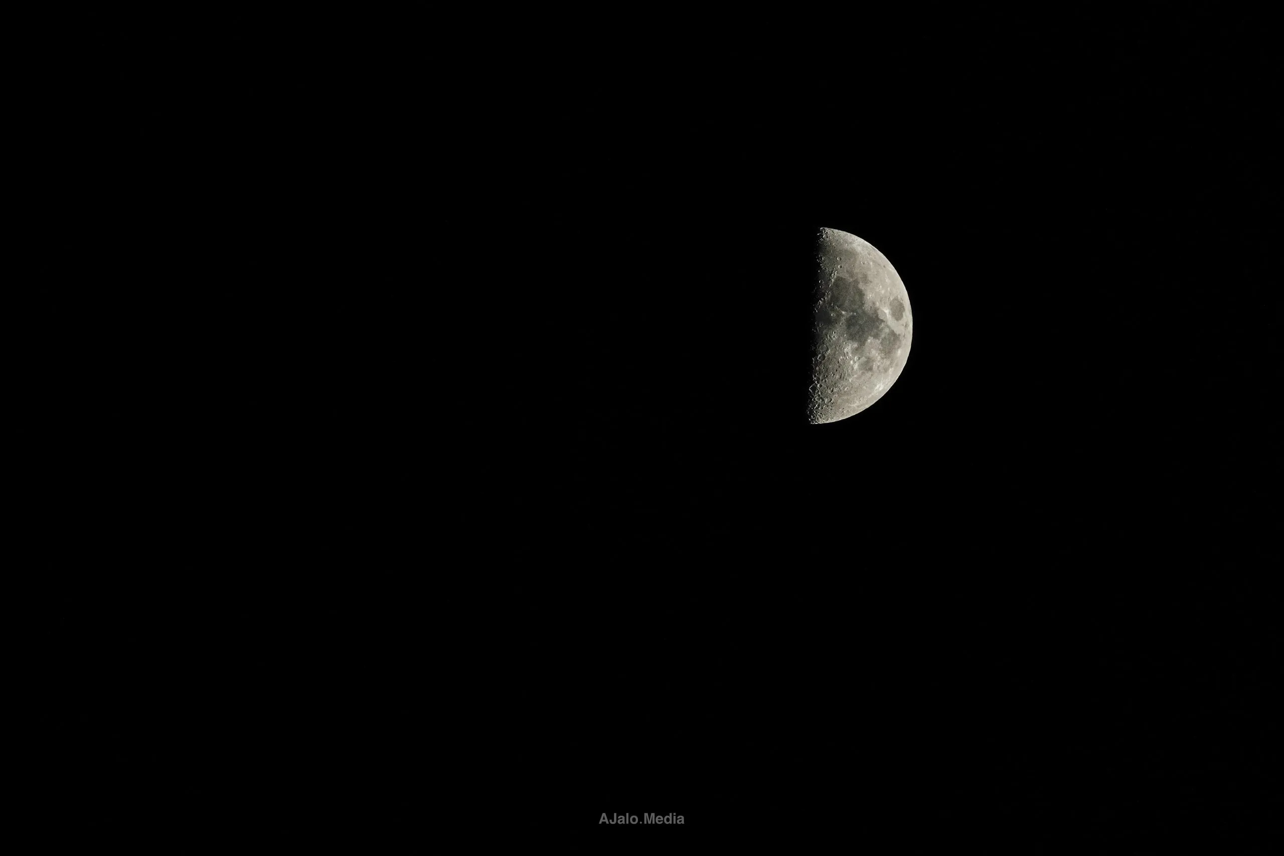 Half moon in a black night sky