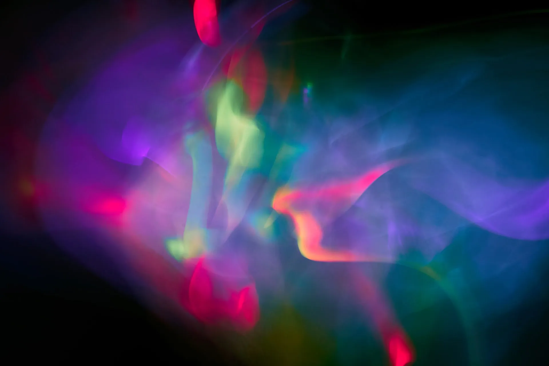Abstract swirls of pink, green and blue light