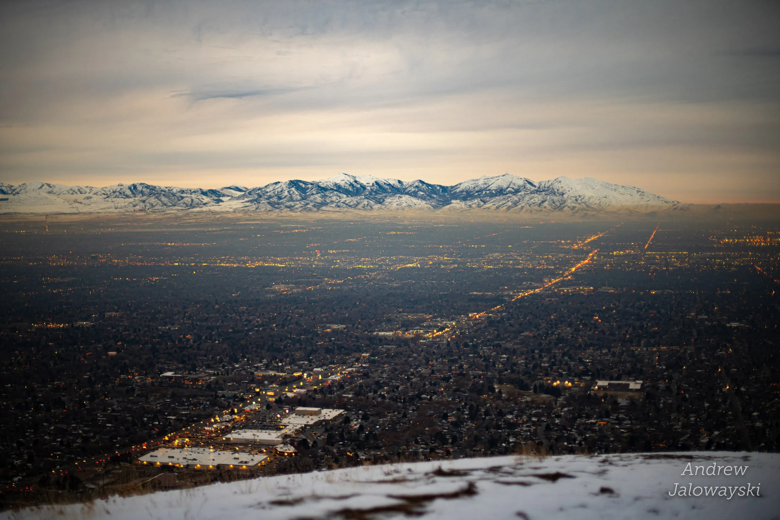 Salt Lake valley at dusk with snowy mountains on the horizon