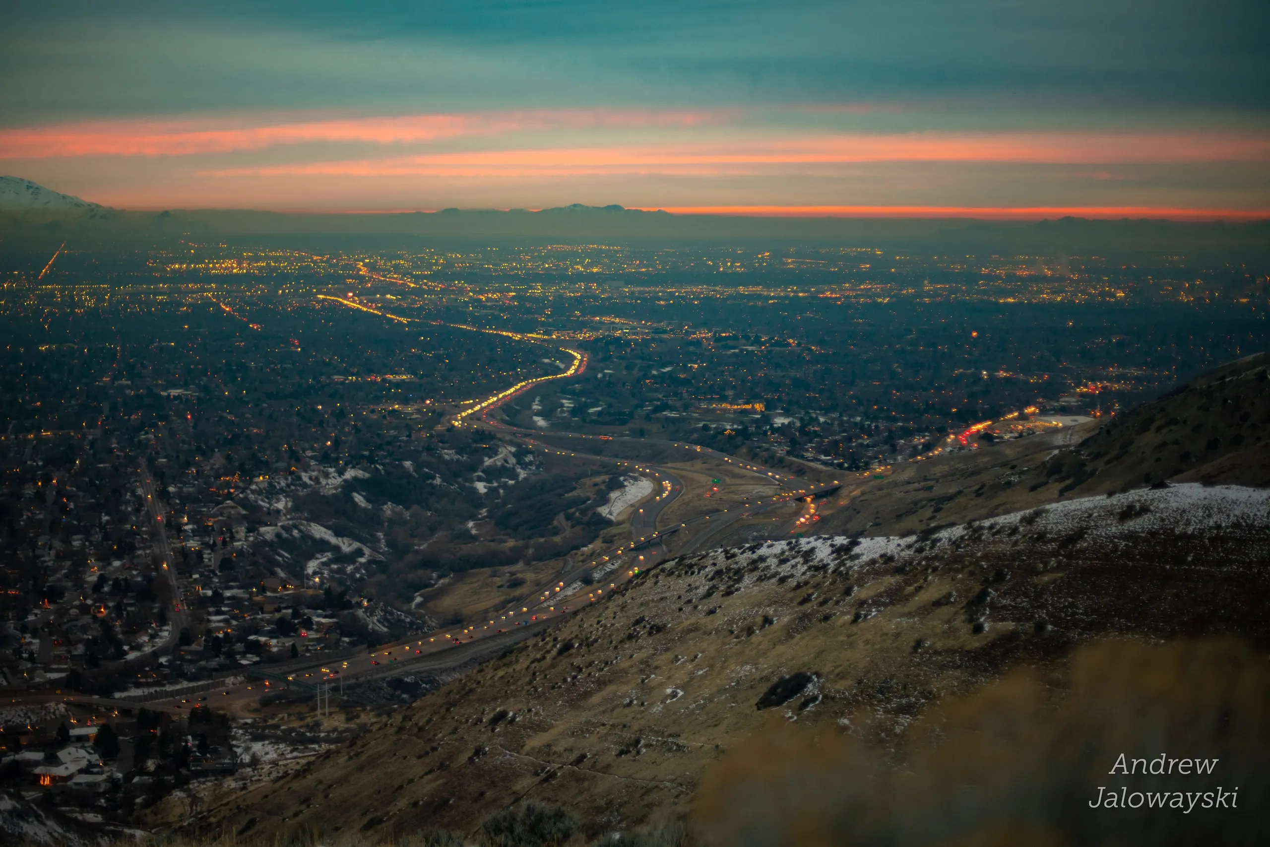 City lights and roads across the valley at blue hour